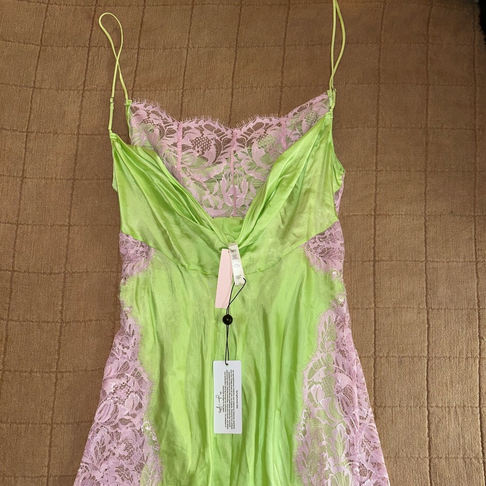 Sexy mini dress with lace slits and cowl neck! Never worn, new with tags.